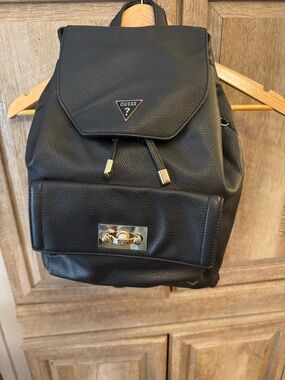 GUESS Black Pebbled Leather Drawstring Backpack with Gold Hardware
